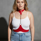 Plus size red leather body harness with chain detail worn over a white tank top