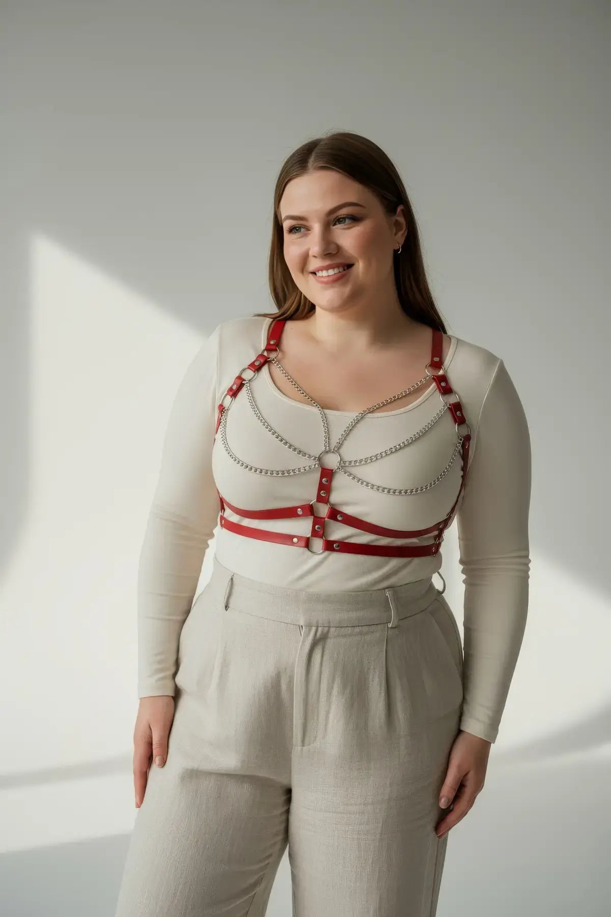HarnessClub plus-size red vegan-leather chest harness with silver chain drapes