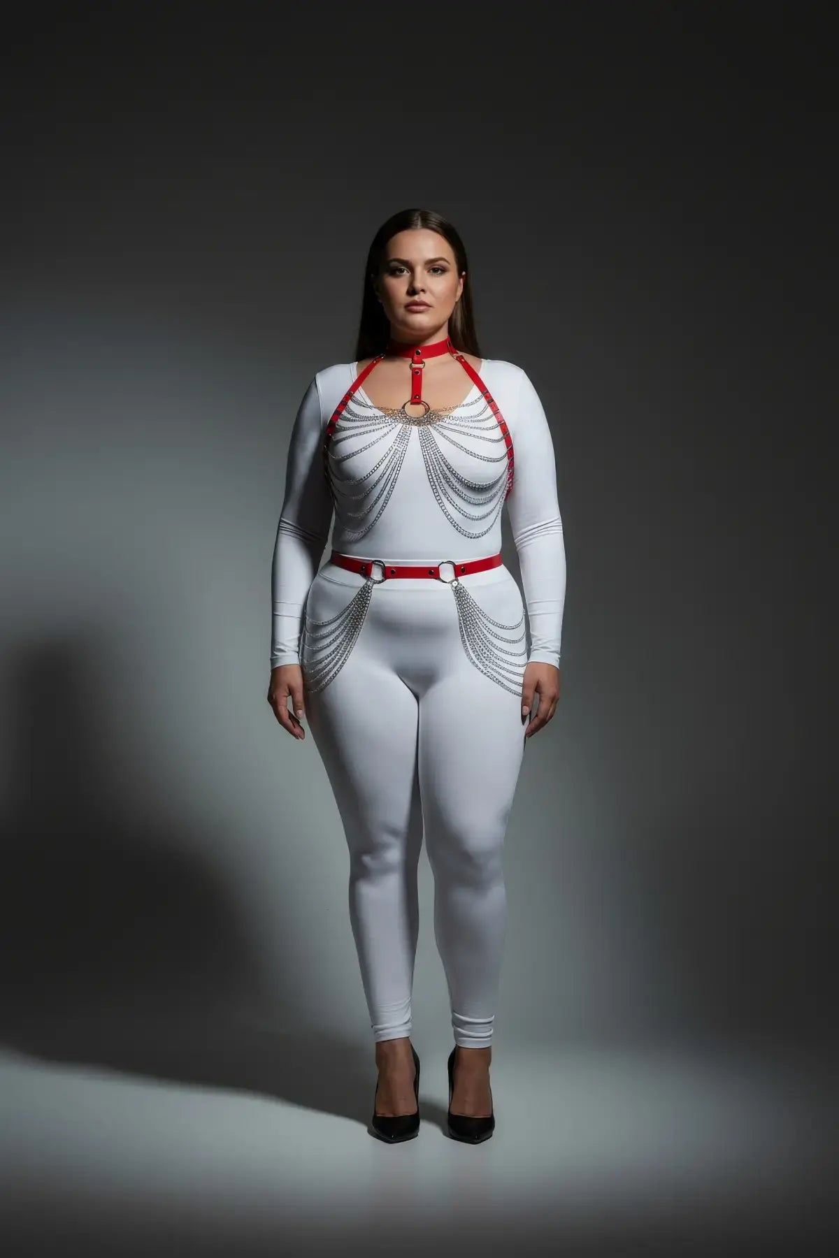 Plus-size red chain-swag collar and waist harness set in vegan leather worn over a white bodysuit; HarnessClub.