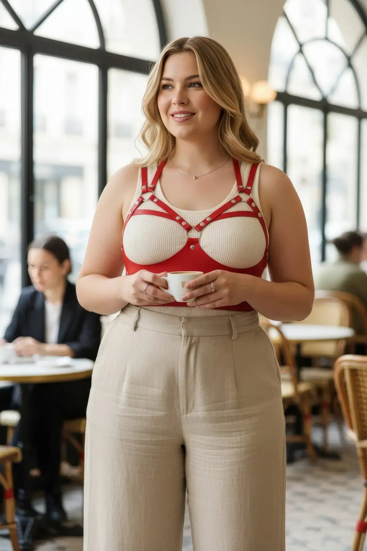 Plus Size Red Leather Body Harness by HarnessClub worn over a beige tank top.