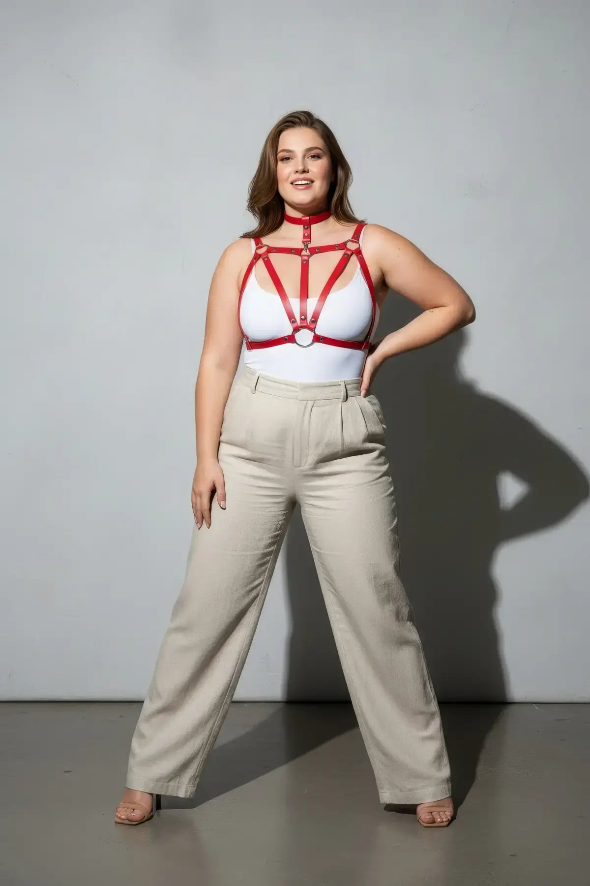 Plus-size red vegan leather chest harness with choker and cage-style straps