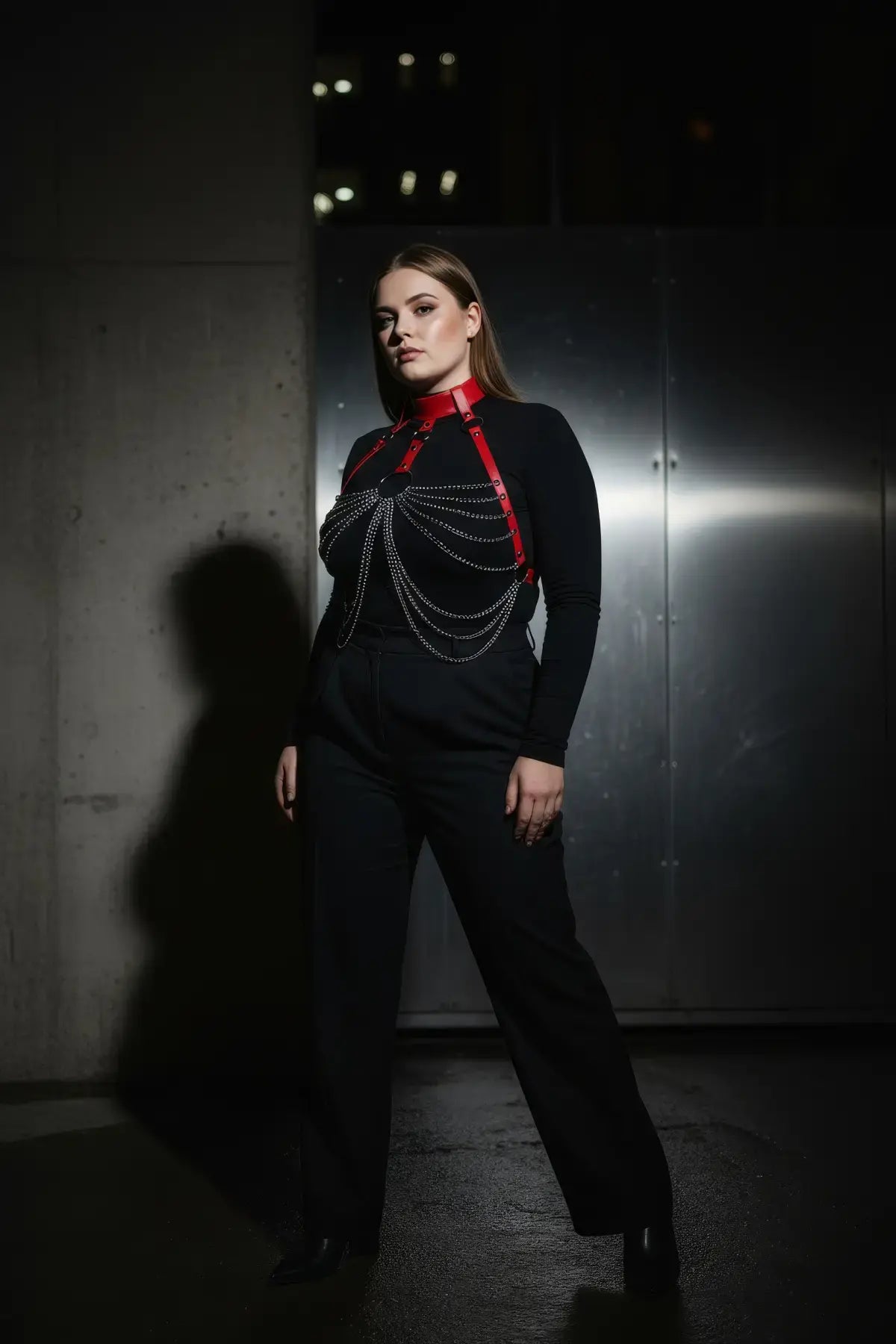 Plus size red choker chain bib harness by HarnessClub; vegan leather red collar with silver chains over black top.