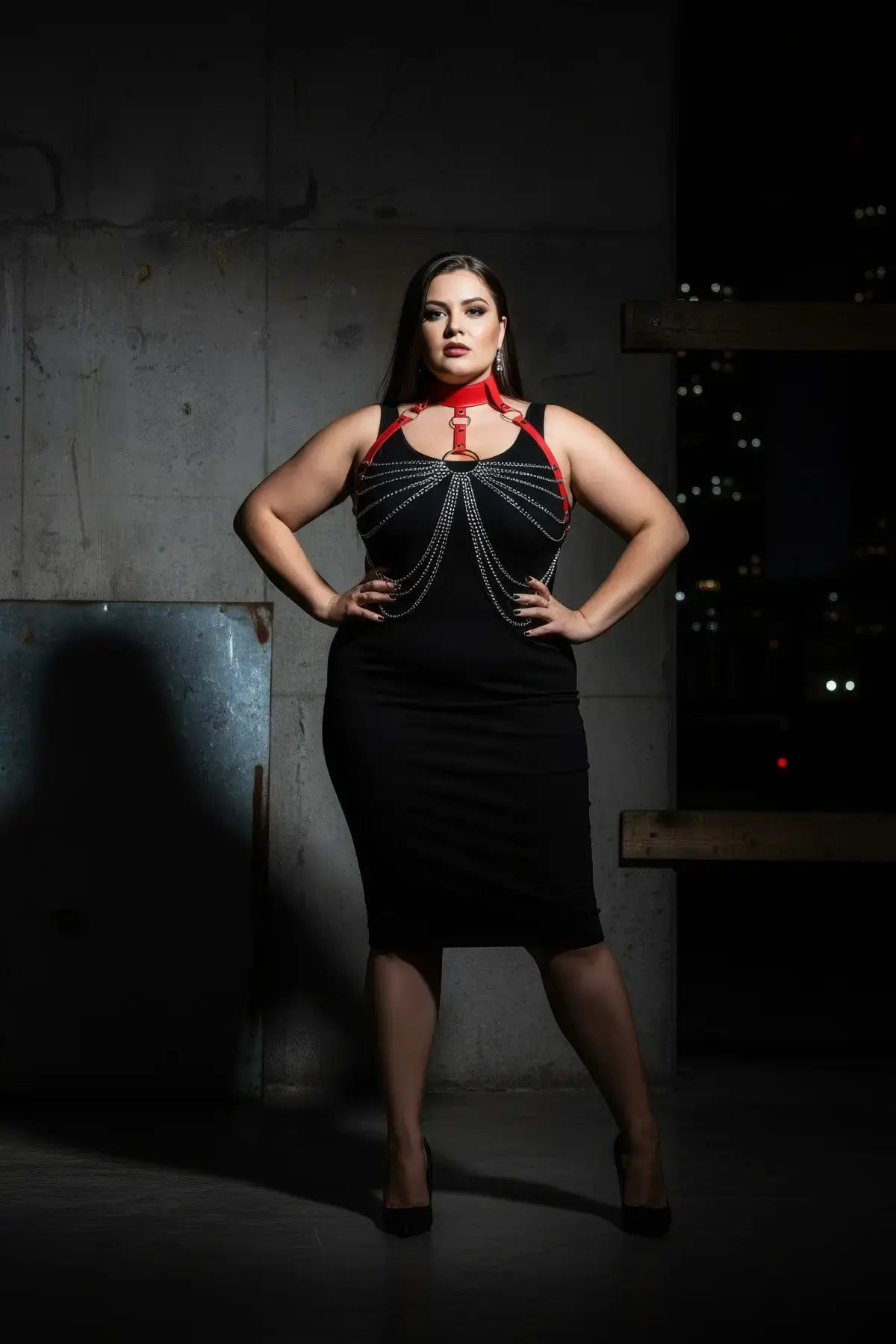 Plus Size Red Choker Chain Bib Harness by HarnessClub in vegan leather, worn over a black dress.
