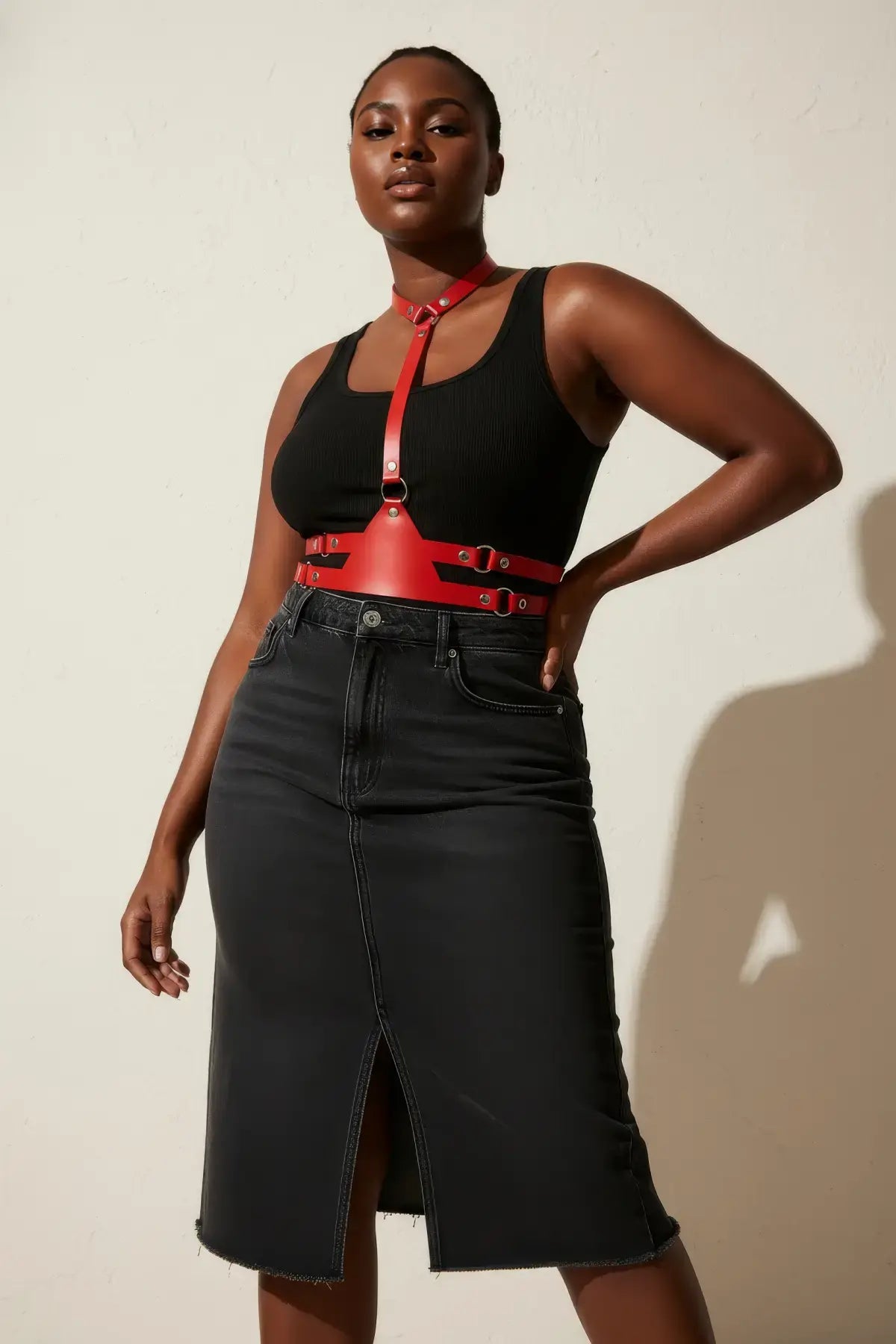 Plus Size red vegan-leather choker V-harness and corset waist set by HarnessClub, worn over a black top.