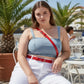 Plus Size Red Classic Buckle Leather Belt worn at the waist on a model