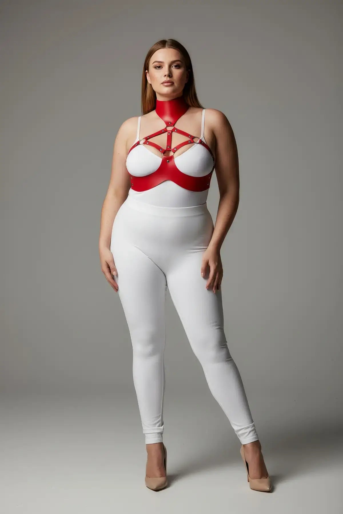Plus-size red collar-detail faux leather chest harness set worn over a white bodysuit.