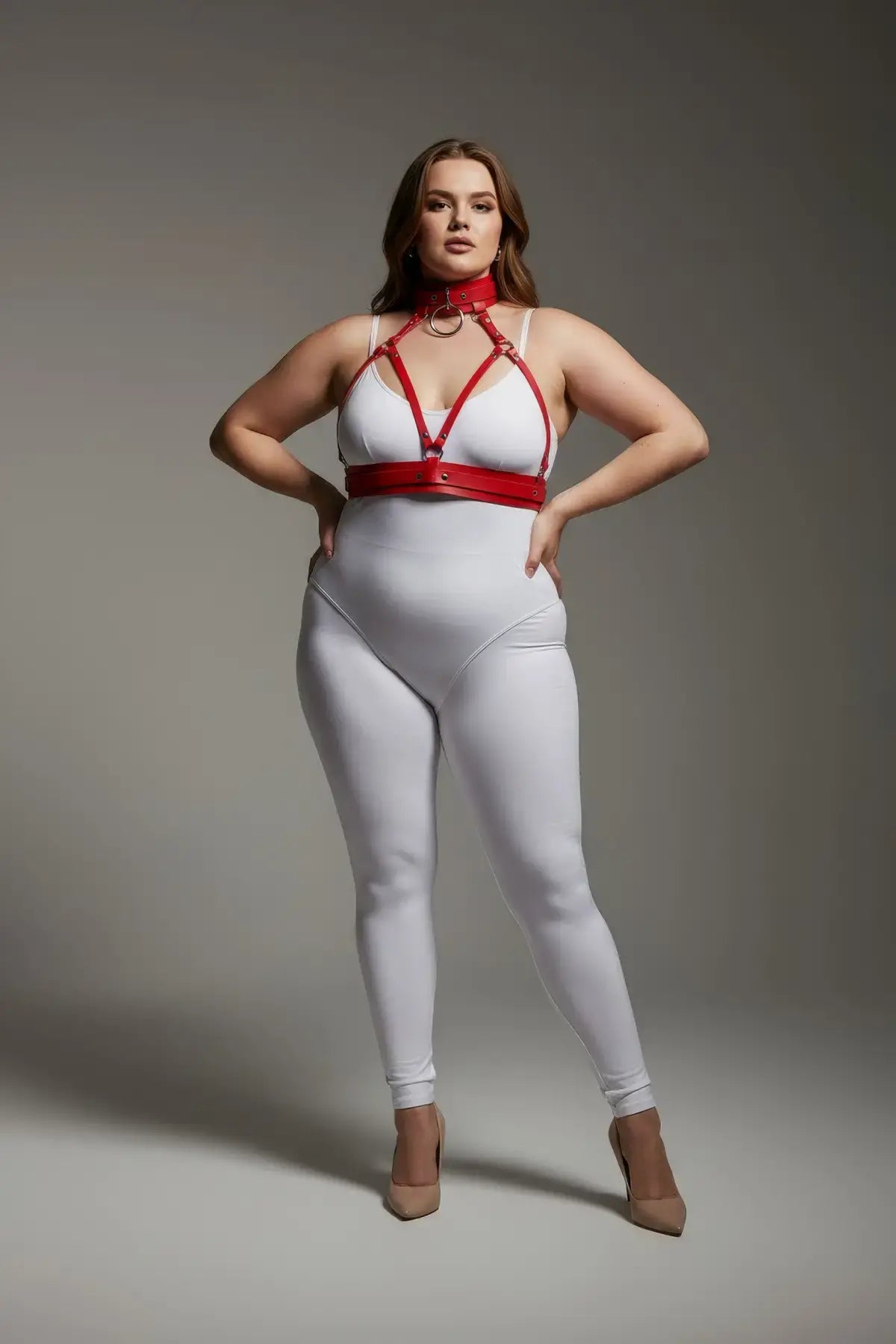Plus-size red collar-detail faux leather harness set worn over a white bodysuit, by HarnessClub