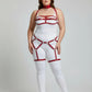 Plus-size red vegan leather complete garter body harness worn over a white bodysuit with chest and leg straps