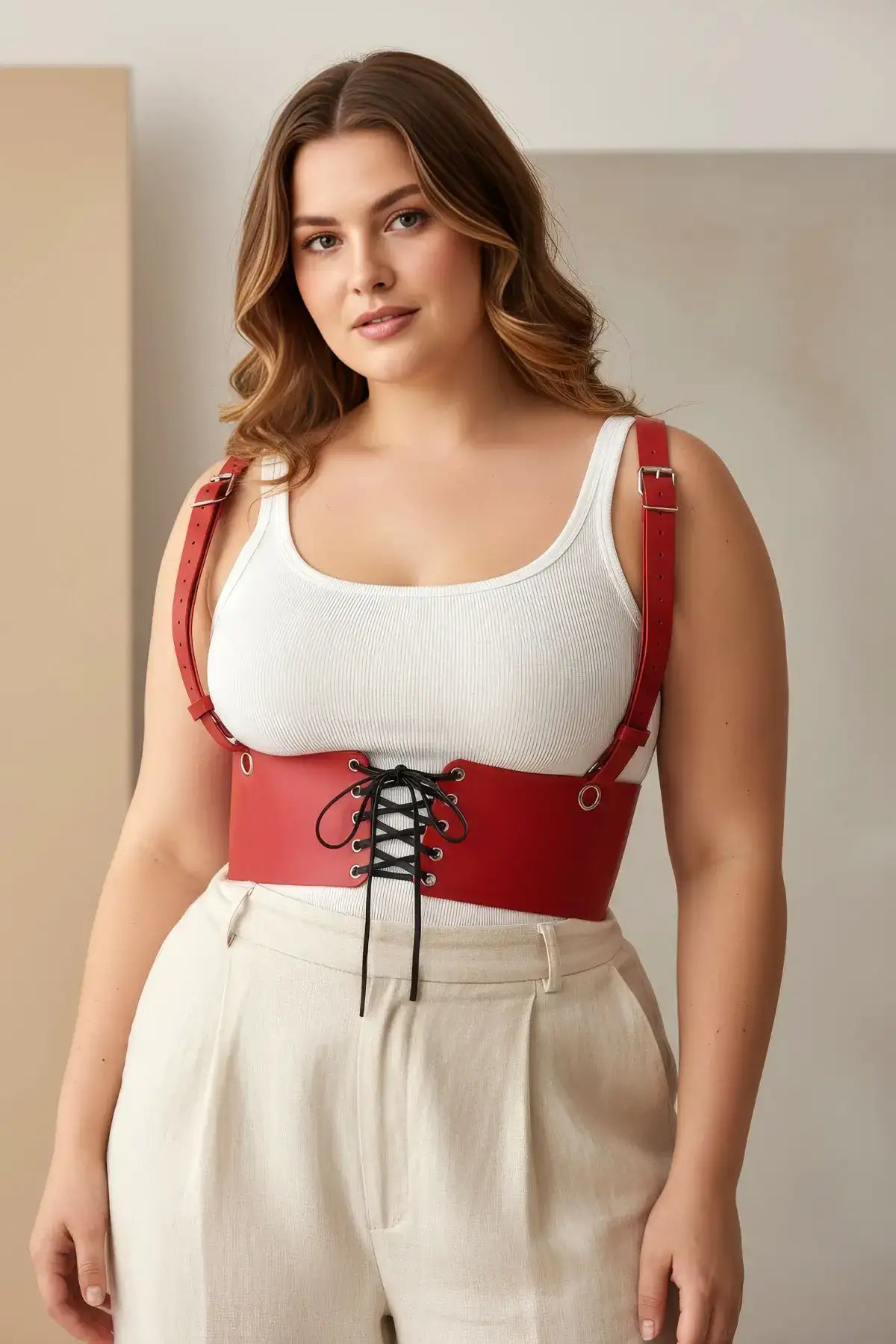 Plus-size red corset harness by HarnessClub; vegan leather with lace-up front and adjustable shoulder straps
