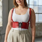 Plus-size red vegan-leather corset harness with lace-up front and adjustable shoulder straps