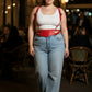 Plus-size red studded leather corset-style belt with harness straps by HarnessClub