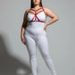Plus-size red faux-leather cross-strap harness by HarnessClub on model
