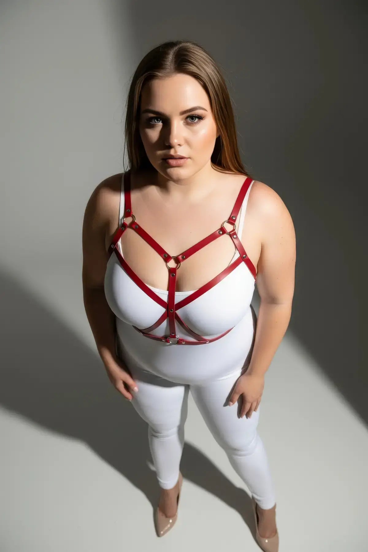 Plus Size Red Cross-Strap Faux Leather Harness worn over a white bodysuit