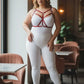 Plus Size Red Cross-Strap Faux Leather Harness by HarnessClub worn over white bodysuit.