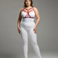 Plus Size Red Cross-Strap Faux Leather Harness with geometric straps worn over a white bodysuit