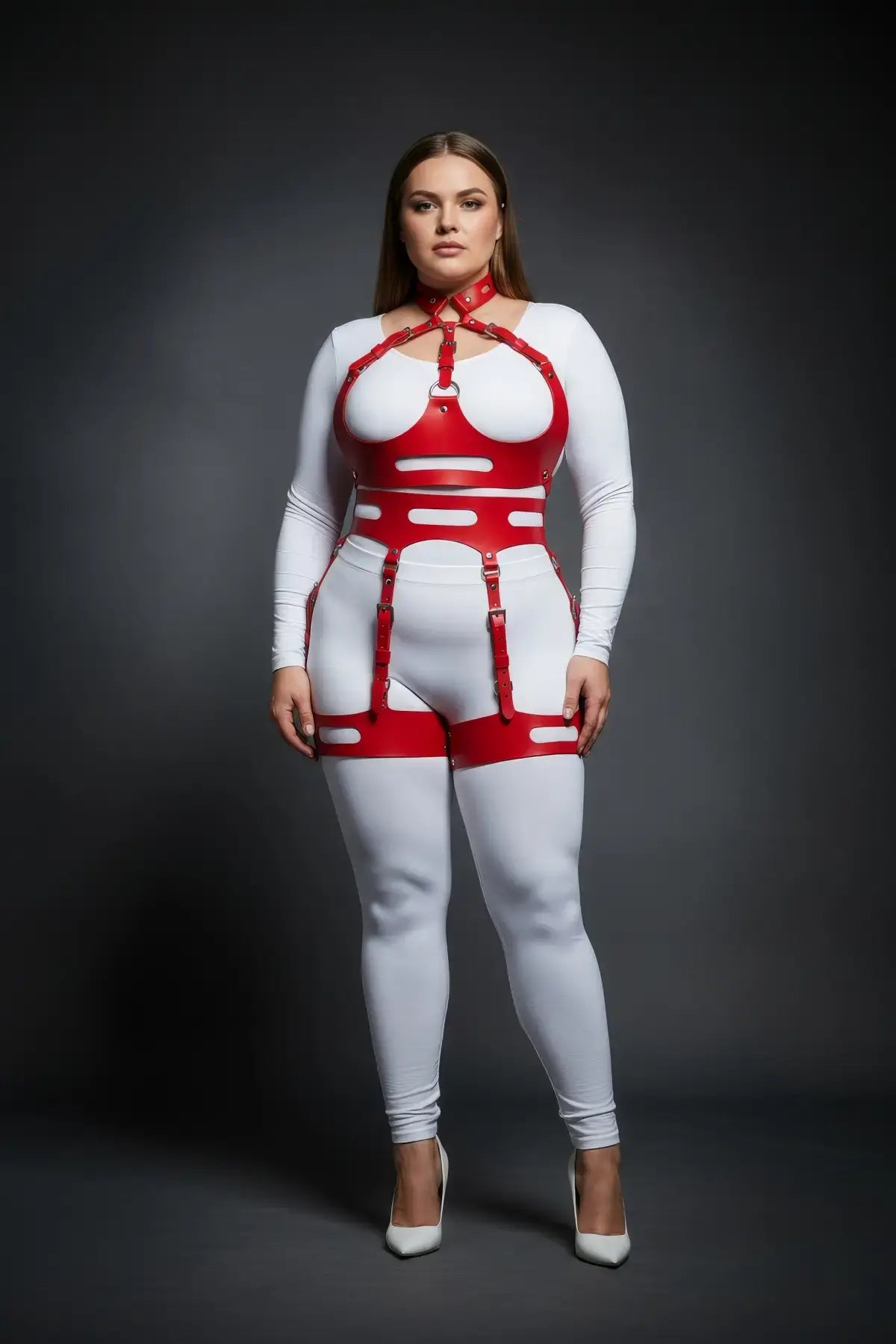 Plus-size red vegan-leather harness bodysuit with halter collar and cutout panels on white base