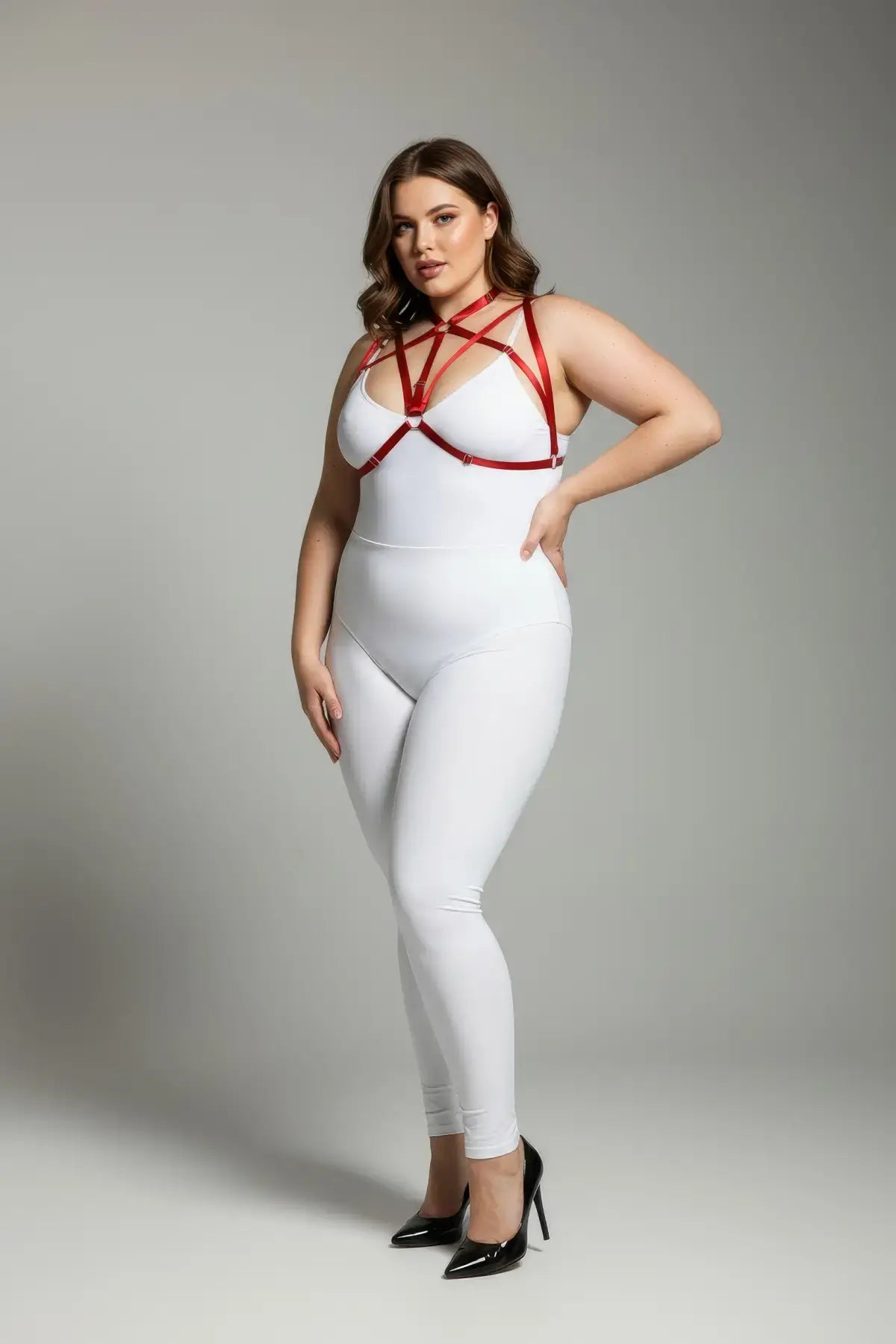 Plus Size Red Elastic O-Ring Fantasy Harness Set by HarnessClub, worn over a white bodysuit