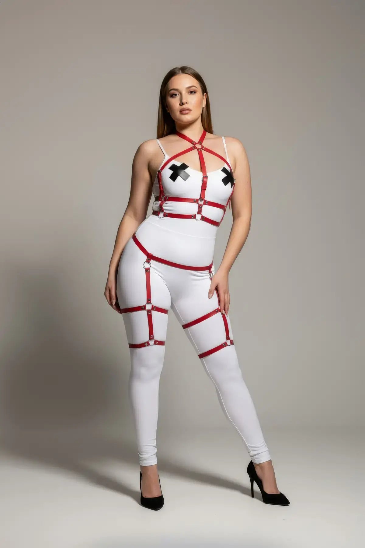 Plus size red vegan leather garter harness body set by HarnessClub on a white bodysuit with adjustable red straps