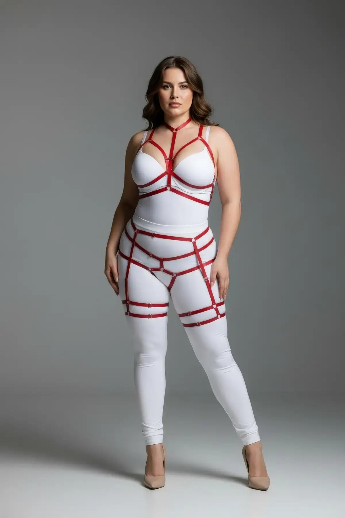 Plus Size Red Full-Body Cage Garter Harness by HarnessClub in vegan leather on a white bodysuit.