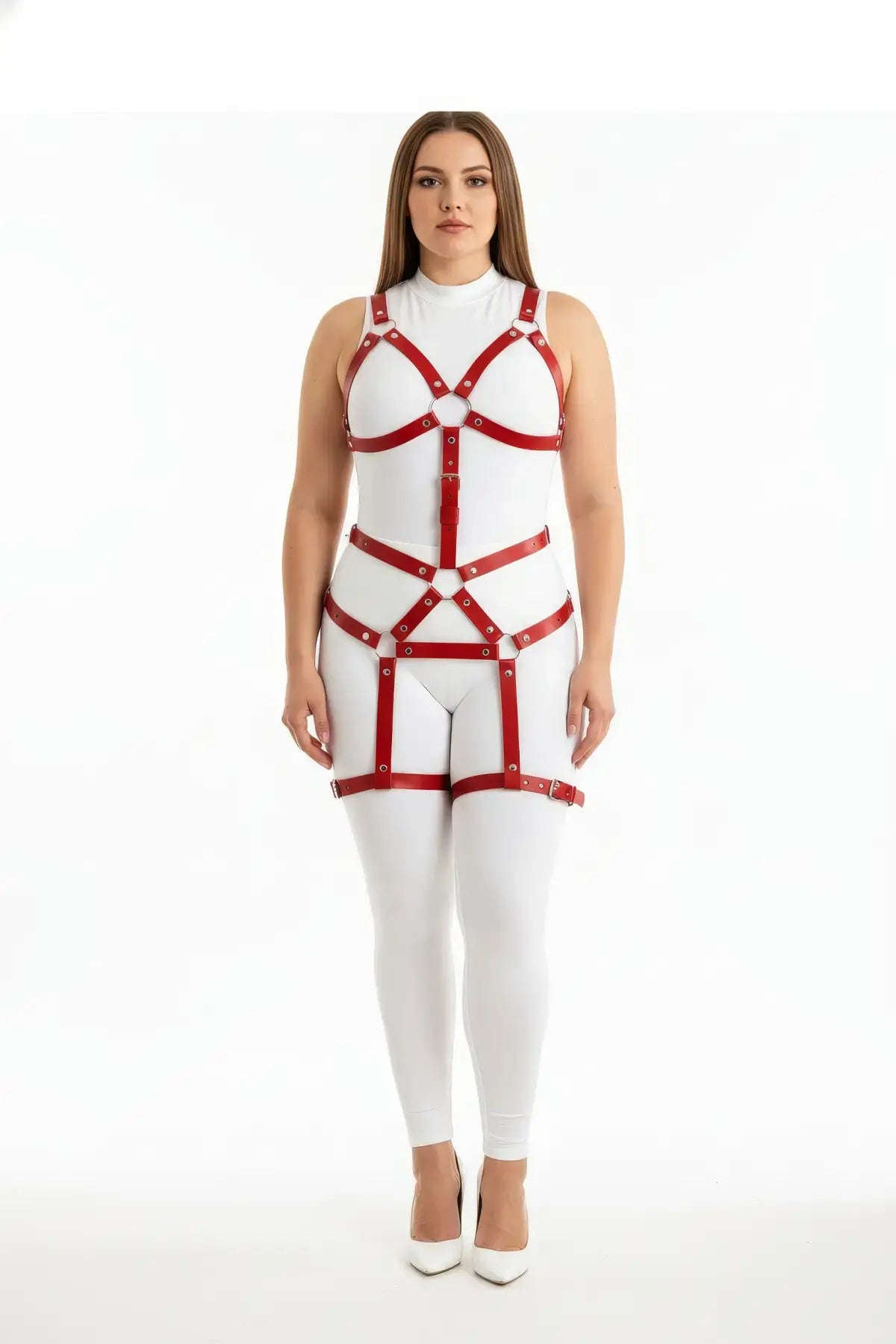 Plus-size red full-body garter harness in vegan leather worn over a white bodysuit.