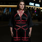 Plus Size Red Full-Body Garter Harness by HarnessClub in vegan leather, a multi-zone body accessory worn over a dress.