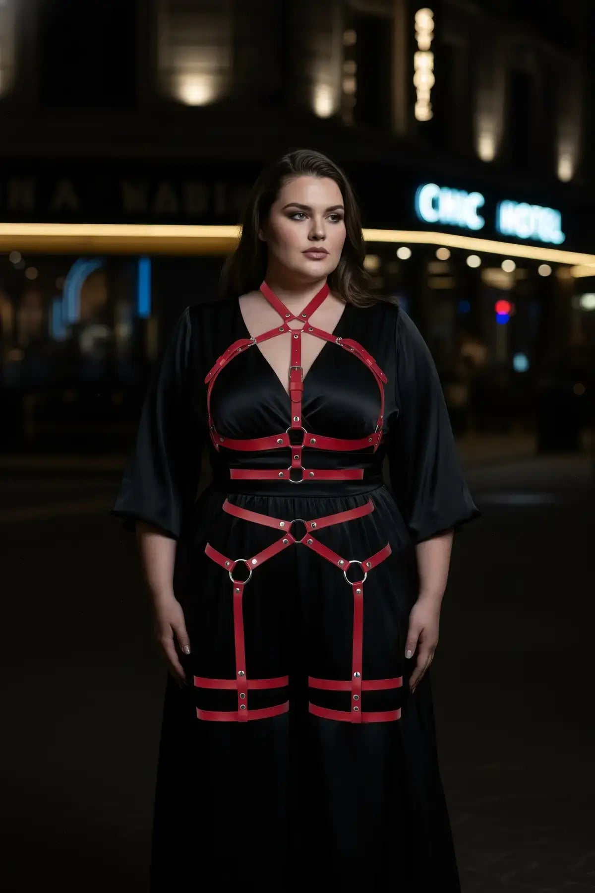 Plus Size Red Full-Body Garter Harness by HarnessClub in vegan leather, a multi-zone body accessory worn over a dress.