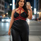 Plus Size Red Full-Torso Collar Harness in vegan leather worn over a black dress; HarnessClub