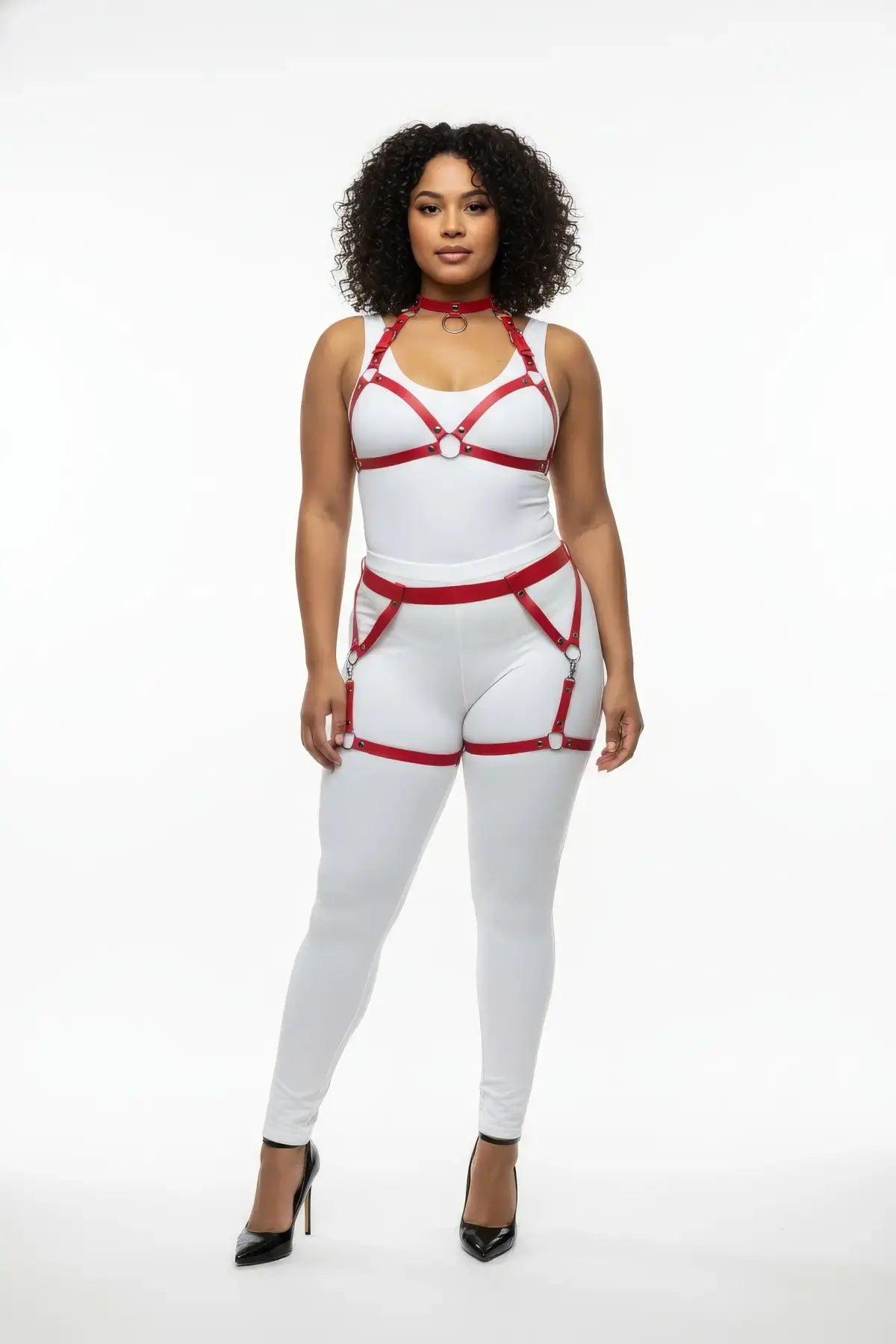 Plus-size red vegan-leather garter-frame full-body harness set by HarnessClub on a white bodysuit.