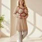Plus Size Red Geometric Cage Chest Harness in vegan leather worn over a beige sweater dress with white sneakers