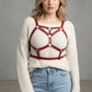 Plus size red geometric cage chest harness by HarnessClub in vegan leather worn over cream sweater