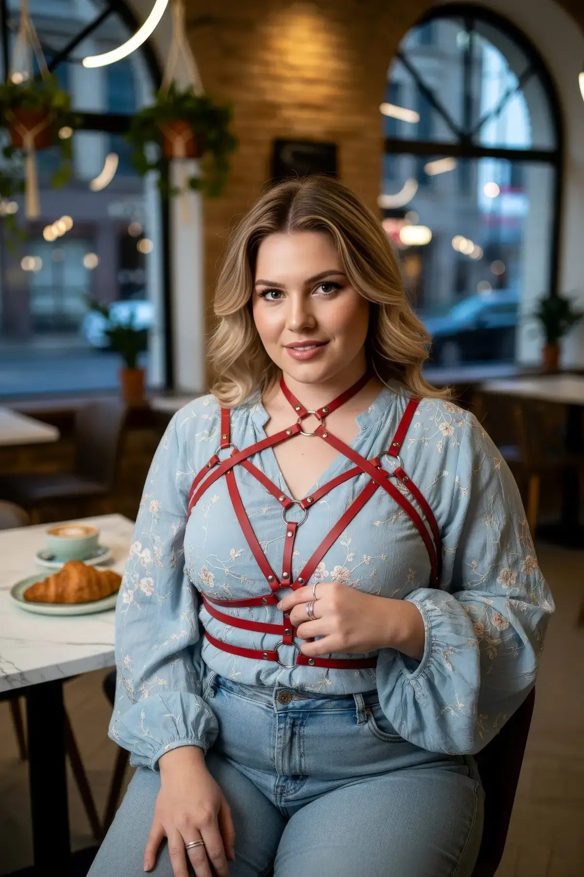Plus Size Red Geometric Star Cage Harness by HarnessClub, vegan leather worn over blue floral top