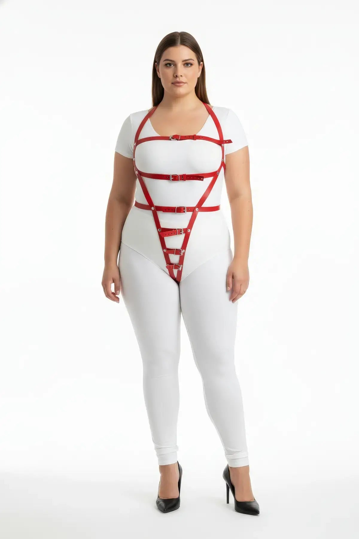 Plus-size red multi-buckle adjustable vegan-leather body harness worn over a white bodysuit.