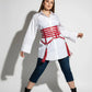 Plus-size red vegan leather corset belt with six horizontal straps and tassels, worn over a white shirt dress.
