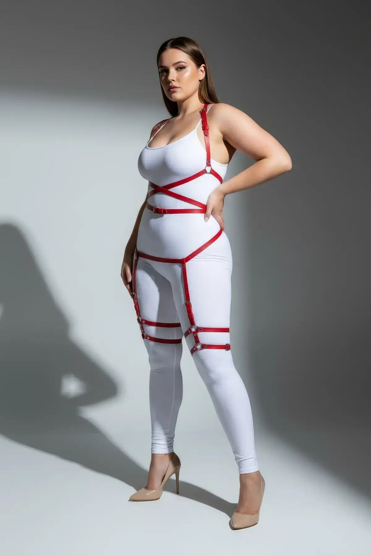 Plus-size red faux leather garter harness with multiple straps on model; full-body accessory set.