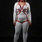 Plus-size red O-ring chain-detail body harness by HarnessClub, vegan leather worn over white bodysuit.