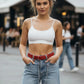 Plus-size red O-ring chain waist belt in vegan leather with twin chains worn with denim jeans