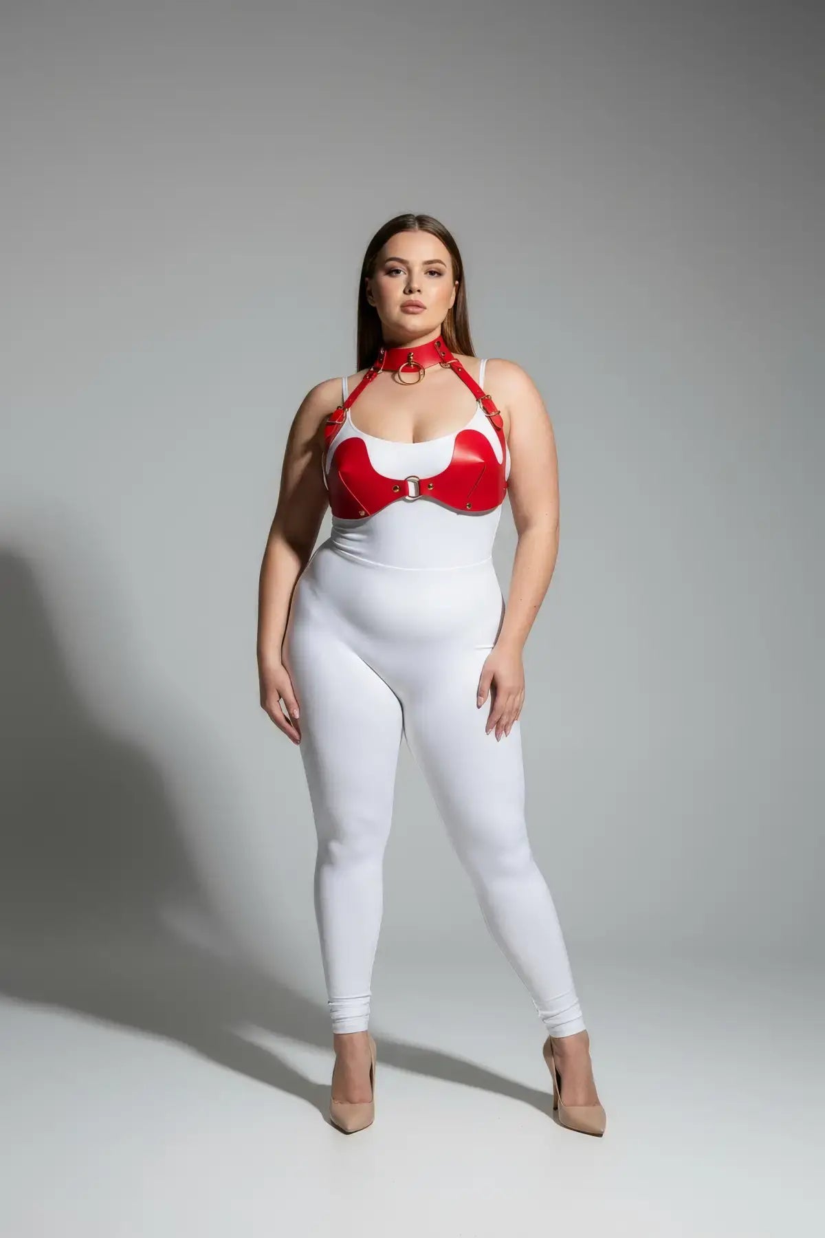Plus-size red faux-leather bra harness with O-ring and neck collar on model