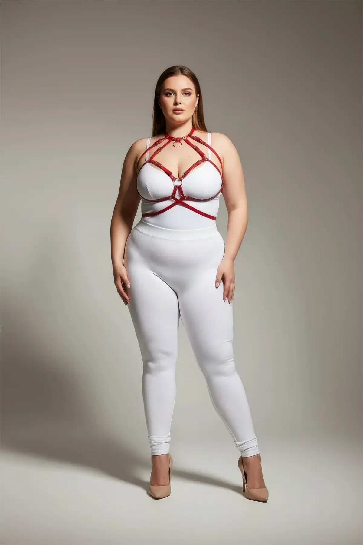 Plus Size Red O-Ring Faux Leather Chest Harness by HarnessClub worn over white bodysuit.