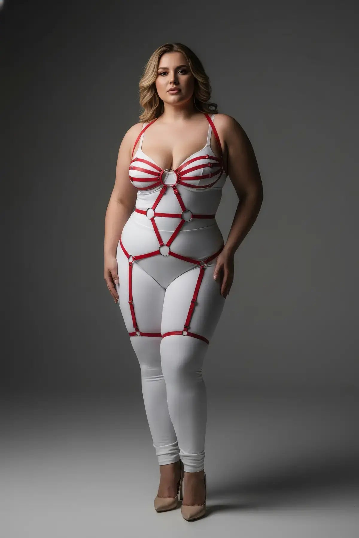 Plus-size red faux-leather O-ring full-body garter harness on white bodysuit