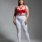 Plus-size red faux-leather chest harness with an O-ring and multiple straps worn on a model.