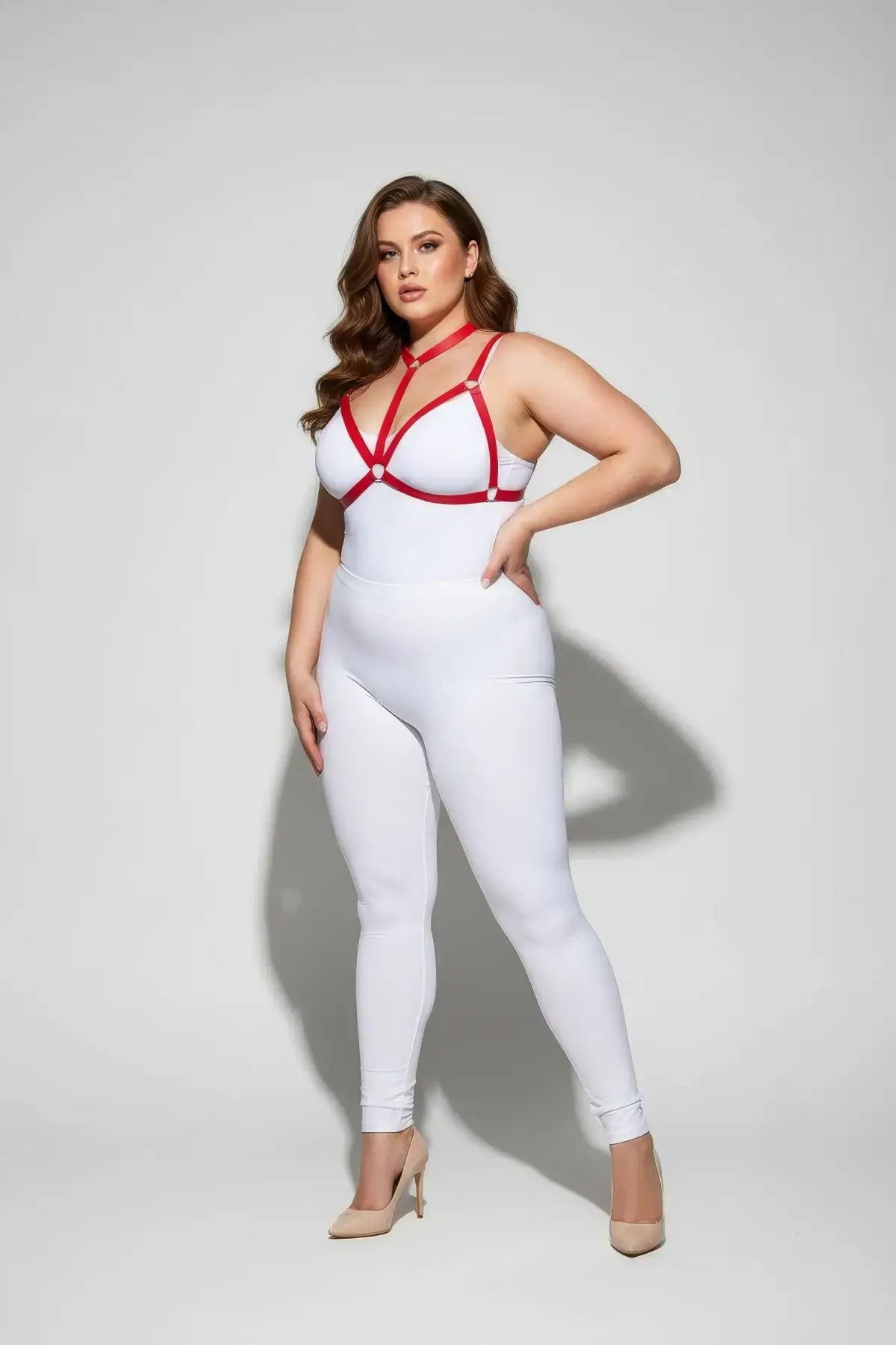 Chest harness, plus-size, red ring-detail elastic straps worn over white bodysuit