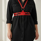 Plus Size red vegan leather shoulder harness and corset waist set worn over a black shirt dress