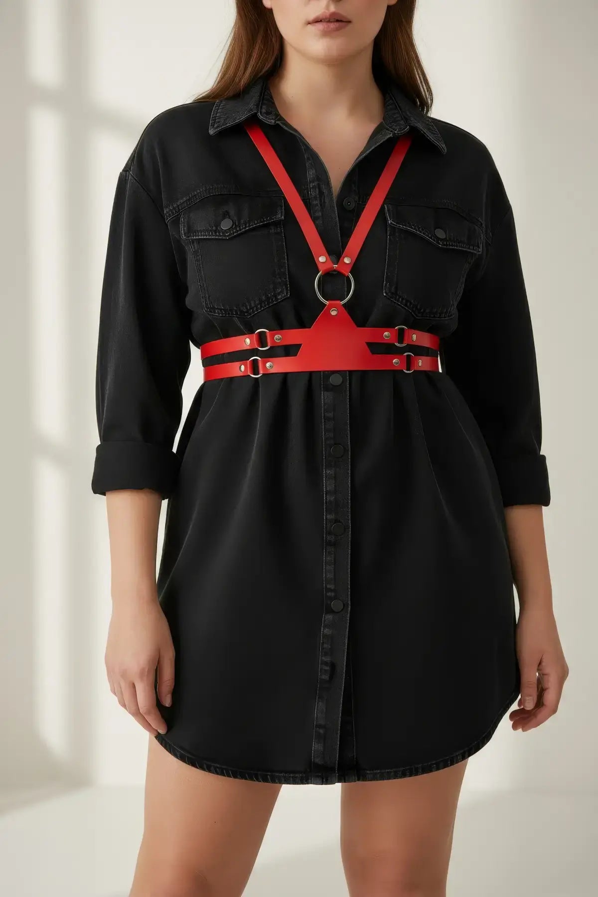 Plus Size red vegan leather shoulder harness and corset waist set worn over a black shirt dress