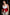 Plus-size red shoulder-harness vest in vegan leather with double buckles and peplum waist cincher
