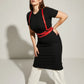 Plus-size red shoulder-strap wrap waist harness in vegan leather by HarnessClub worn over a black dress