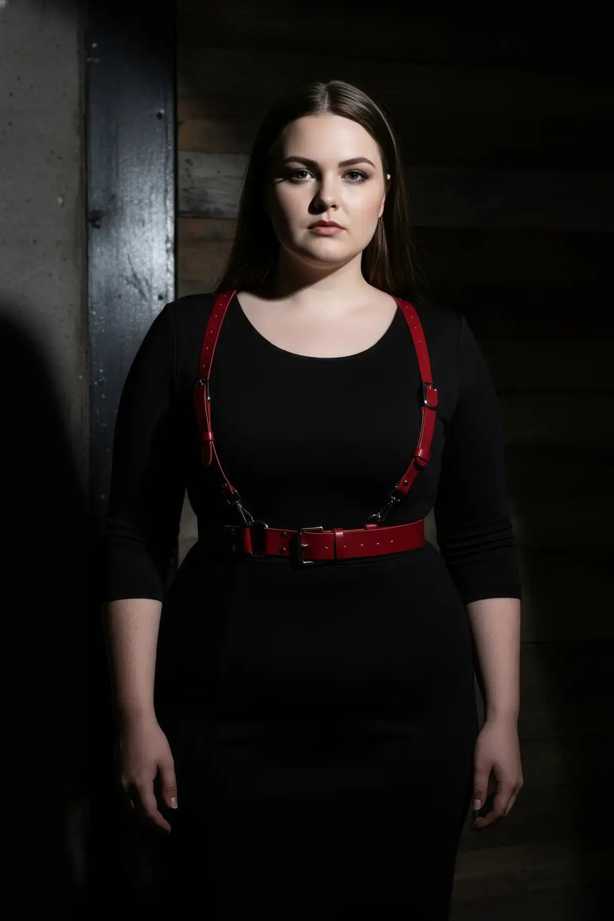 Plus Size Red Strappy Leather Garter Belt with metal buckles worn over a black dress