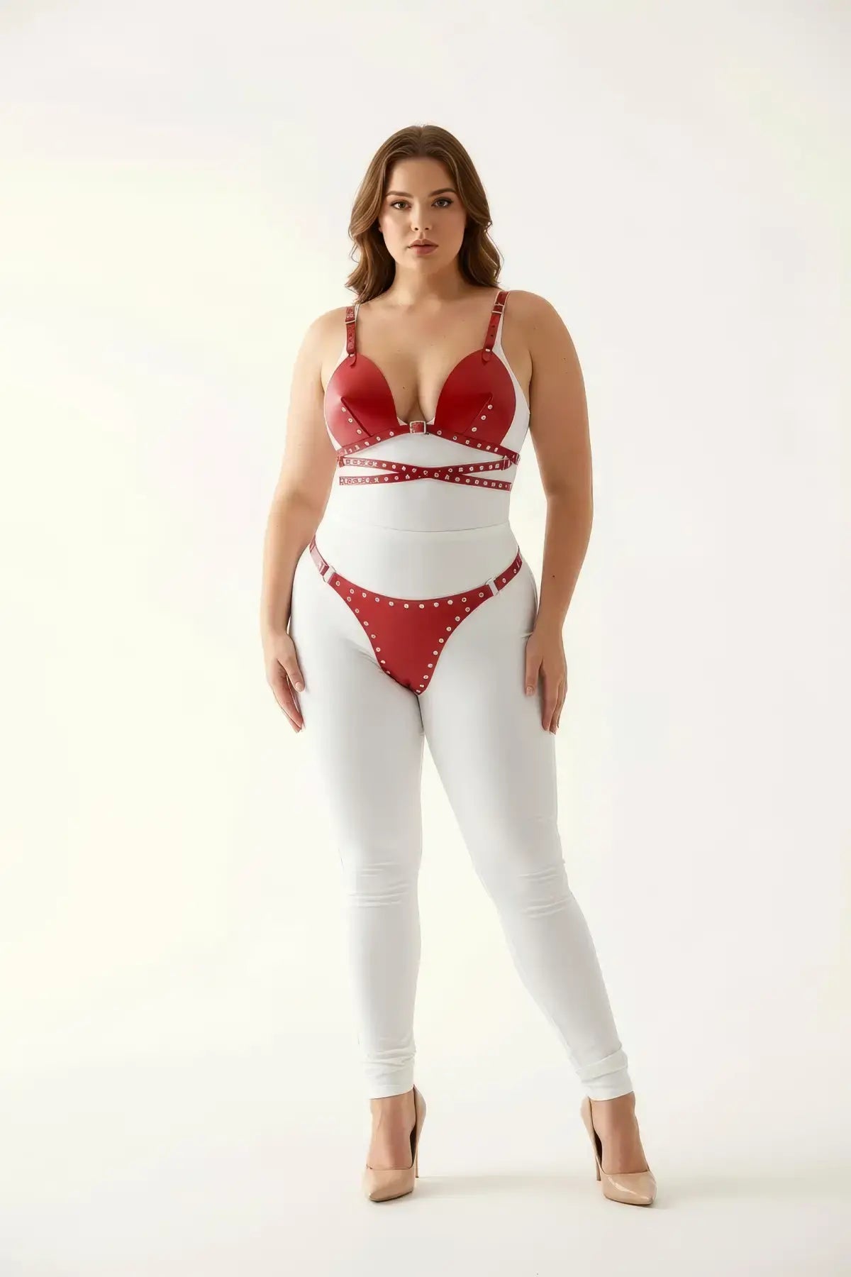 Plus-size red stud-detail faux leather premium harness set by HarnessClub, with matching red bottoms.