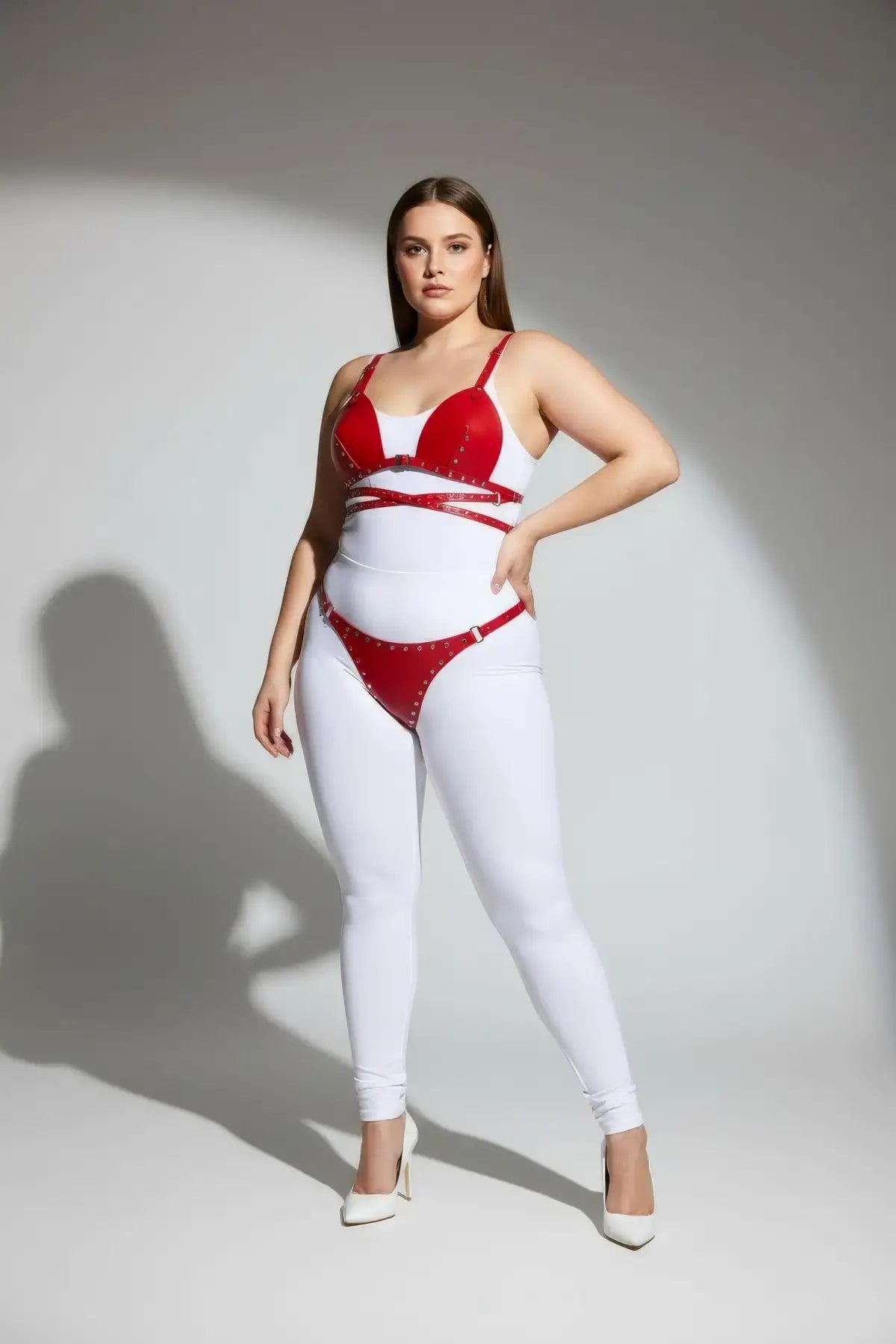 Plus Size Red Stud-Detail Faux Leather Harness Set worn over a white bodysuit