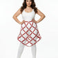 Plus-size red studded lattice cage skirt worn over a white outfit; vegan leather body harness.