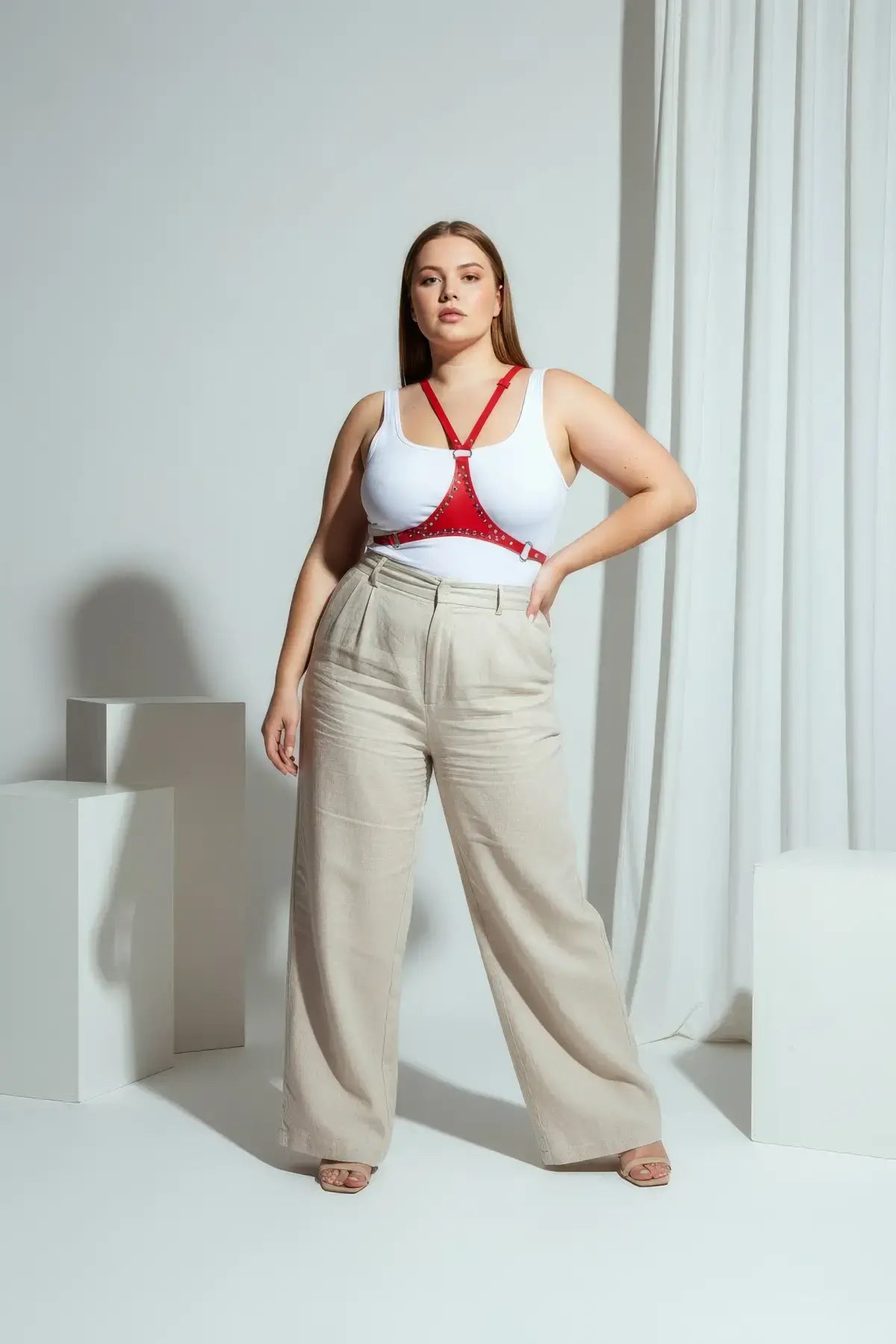 Plus Size Red Studded Leather Body Accessory worn over a white tank top